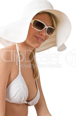 Beach - woman in bikini with hat sunbathing