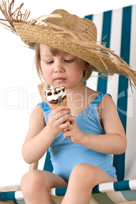 Beach - Little girl on deck-chair with hat and ice-cream