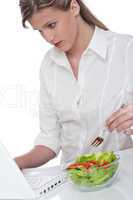 Healthy lifestyle series - Woman with laptop and bowl of salad