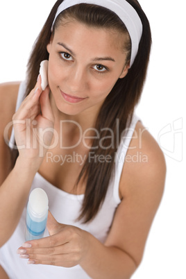 Beauty facial care - Teenager woman cleaning acne skin