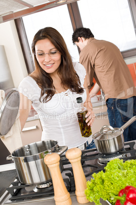 Young couple cook in modern kitchen
