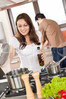 Young couple cook in modern kitchen