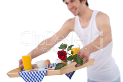 Breakfast - young man holding tray with rose