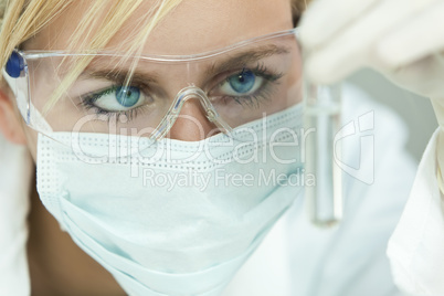 Female Scientist or Woman Doctor Analyzing Test Tube in Laborato