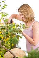 Gardening - woman sprinkling water to plant