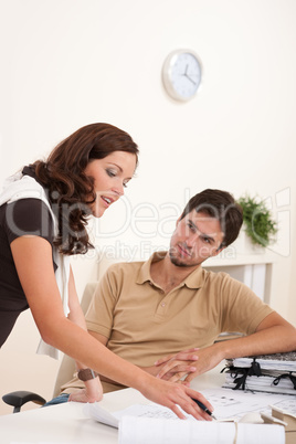 Young woman and man at office