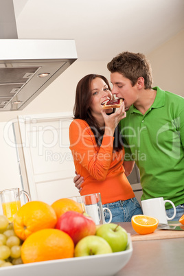 Young man and woman eating toast