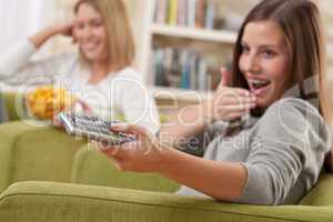 Students - Two female teenager watching television