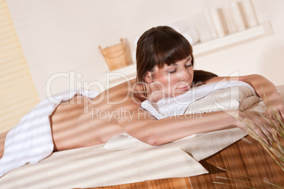 Spa - Young female client at wellness massage