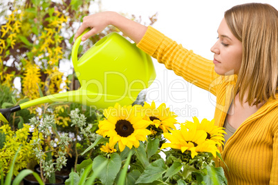 Gardening - woman pouring water to flowers
