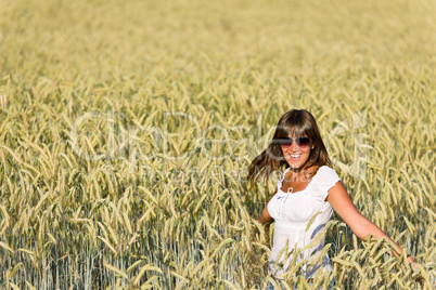 Happy woman in corn field enjoy sunset