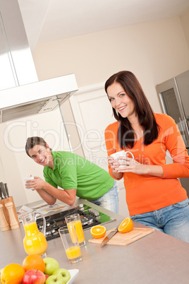 Young woman having coffee in the kitchen
