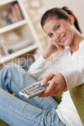 Students - Smiling female teenager watching television