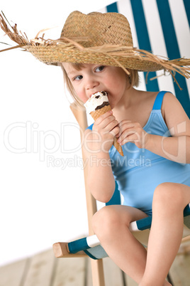 Beach - Little girl on deck-chair with hat and ice-cream