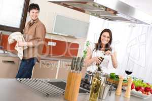 Happy couple cook in modern kitchen