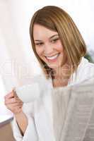 Breakfast - happy woman reading newspaper drink coffee