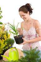 Gardening - woman holding flower pot