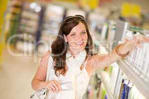Shopping cosmetics - woman with moisturizer