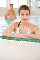 Young woman in bikini relax in swimming pool