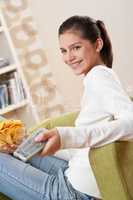 Students - Smiling female teenager watching television