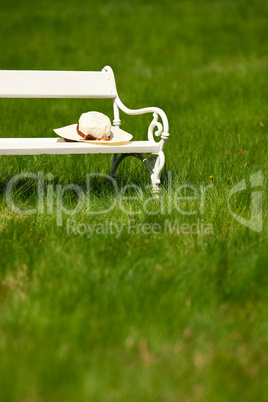 Spring and summer - White romantic bench in meadow