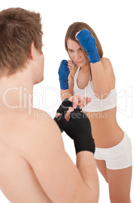 Boxing - Young woman in class training on white