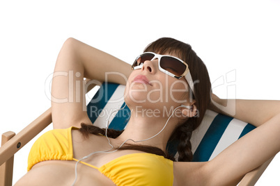 Beach - Woman listen to music in bikini
