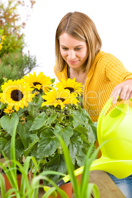 Gardening - woman pouring flowers