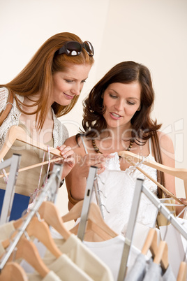 Fashion shopping -  Two happy young woman choose clothes
