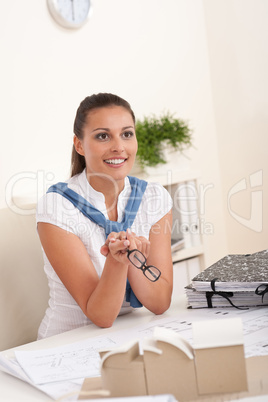 Young female architect sitting at the office