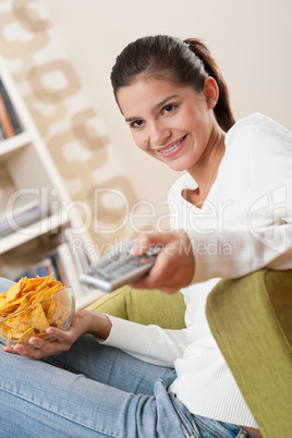Students - Smiling female teenager watching TV
