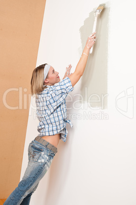 Home improvement: Woman painting wall