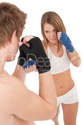 Boxing - Young woman in class training on white