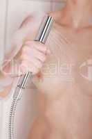 Body care: Woman holding shower head