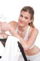 Fitness series - Woman with exercise bike  and bottle of water