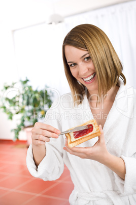 Breakfast - Happy woman with toast and marmalade