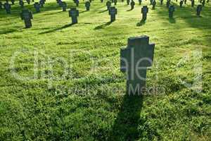 Cemetery with grass during sunset
