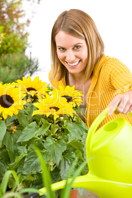 Gardening - woman pouring flowers