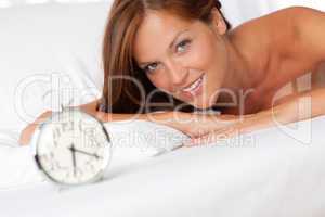 White lounge - Young woman lying in bed