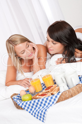 Two young women having home made breakfast