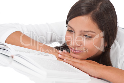 Portrait of teenager reading book