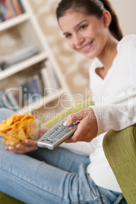 Students - Smiling female teenager watching television