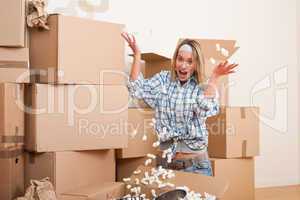Moving house: Young woman having fun