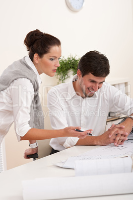 Young man and woman working together Young man and woman working together