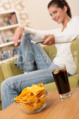 Students - Smiling female teenager watching television