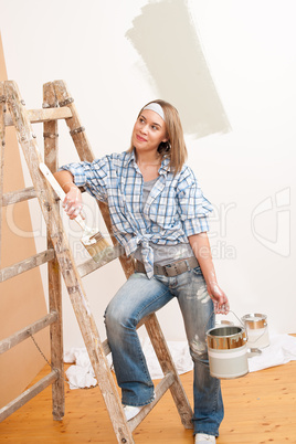 Home improvement: Smiling woman with paint