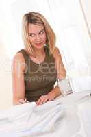 Student series - Blond young woman writing homework