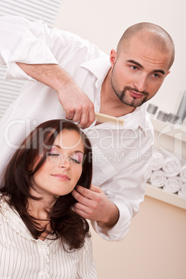 Professional hairdresser comb customer at salon