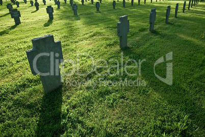 Cemetery with grass during sunset