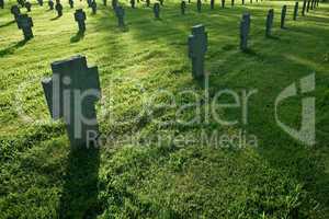 Cemetery with grass during sunset